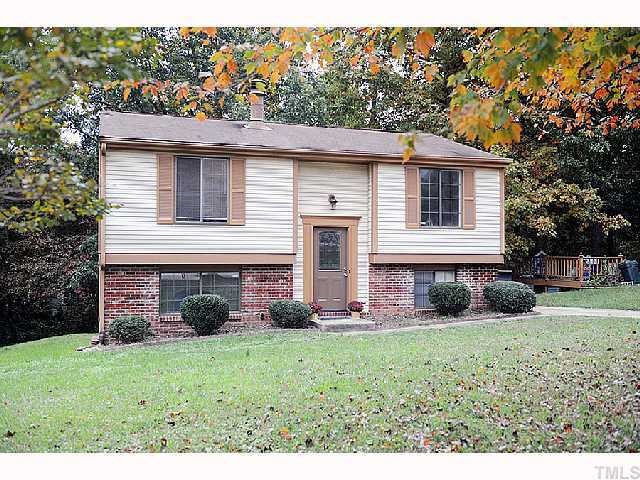 8020 Mourning Dove Road Raleigh, NC 27615 - Photo 1 of 12 a front view of a house with garden