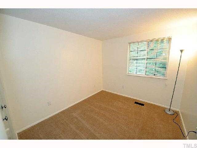 8020 Mourning Dove Road Raleigh, NC 27615 - Photo 11 of 12 a view of an empty room with a window