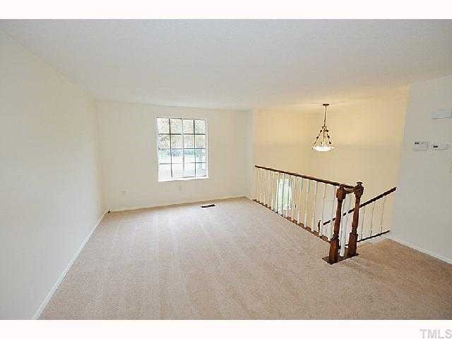 8020 Mourning Dove Road Raleigh, NC 27615 - Photo 4 of 12 a view of an empty room with a window
