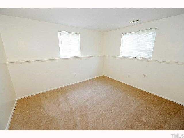 8020 Mourning Dove Road Raleigh, NC 27615 - Photo 10 of 12 a view of an empty room with a window