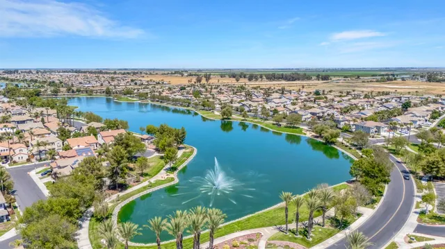 an aerial view of a city with lawn chairs
