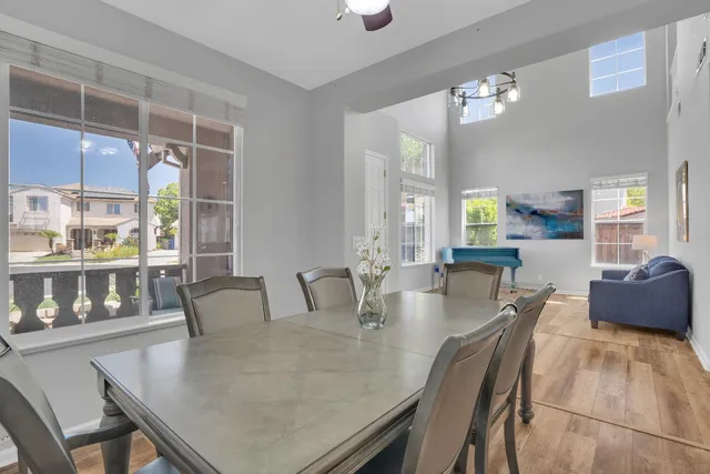 a dining room with furniture and window