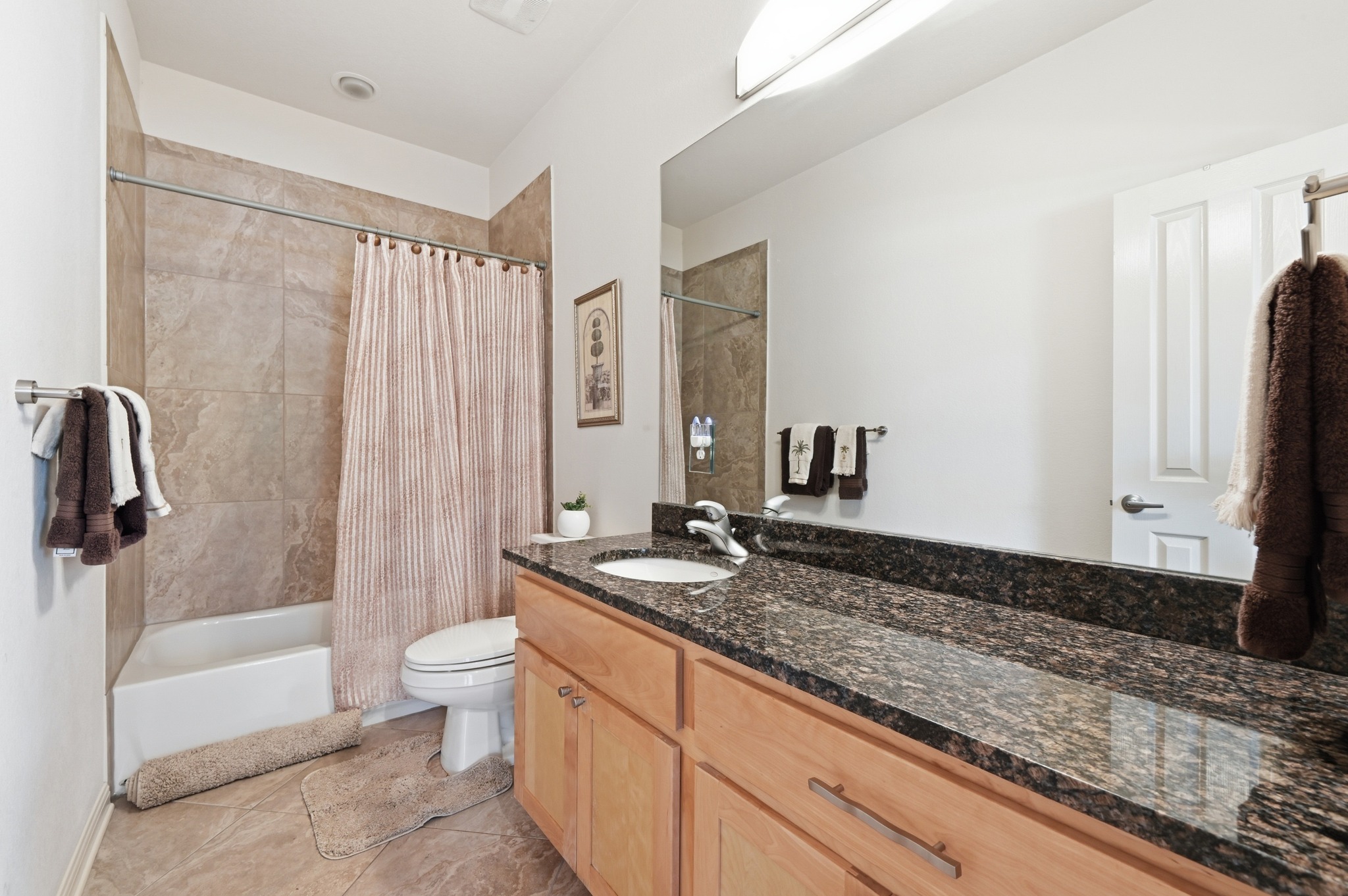 7301 Seneca Falls Loop Austin, TX 78739 - Photo 27 of 36 This secondary bath has beautiful granite countertop and ample storage.