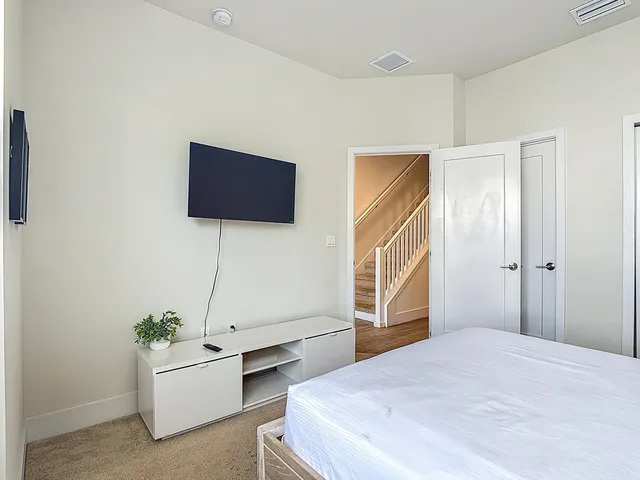 a view of hallway with bathroom