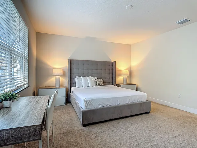 a bath room with a sink and a mirror