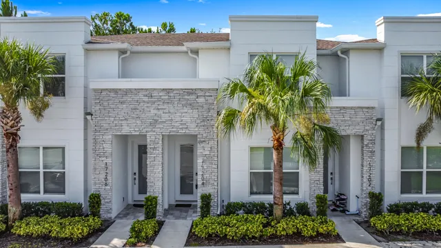 a front view of a house with a glass door