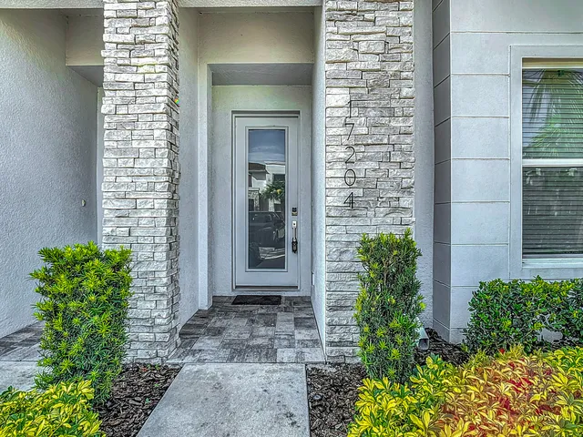 a view of front door with wooden floor