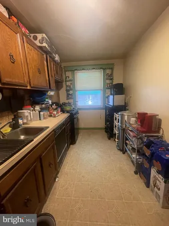 a kitchen with a sink cabinets and appliances