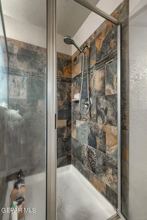 a bedroom with a bed and a desk