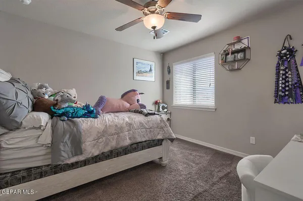 a view of a hallway with wooden floor and cabinet