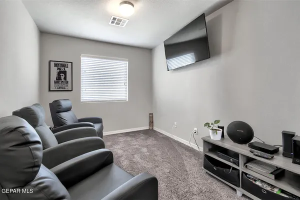 a view of a patio with a table chairs and a patio