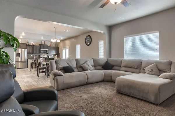 a living room with furniture and a large window