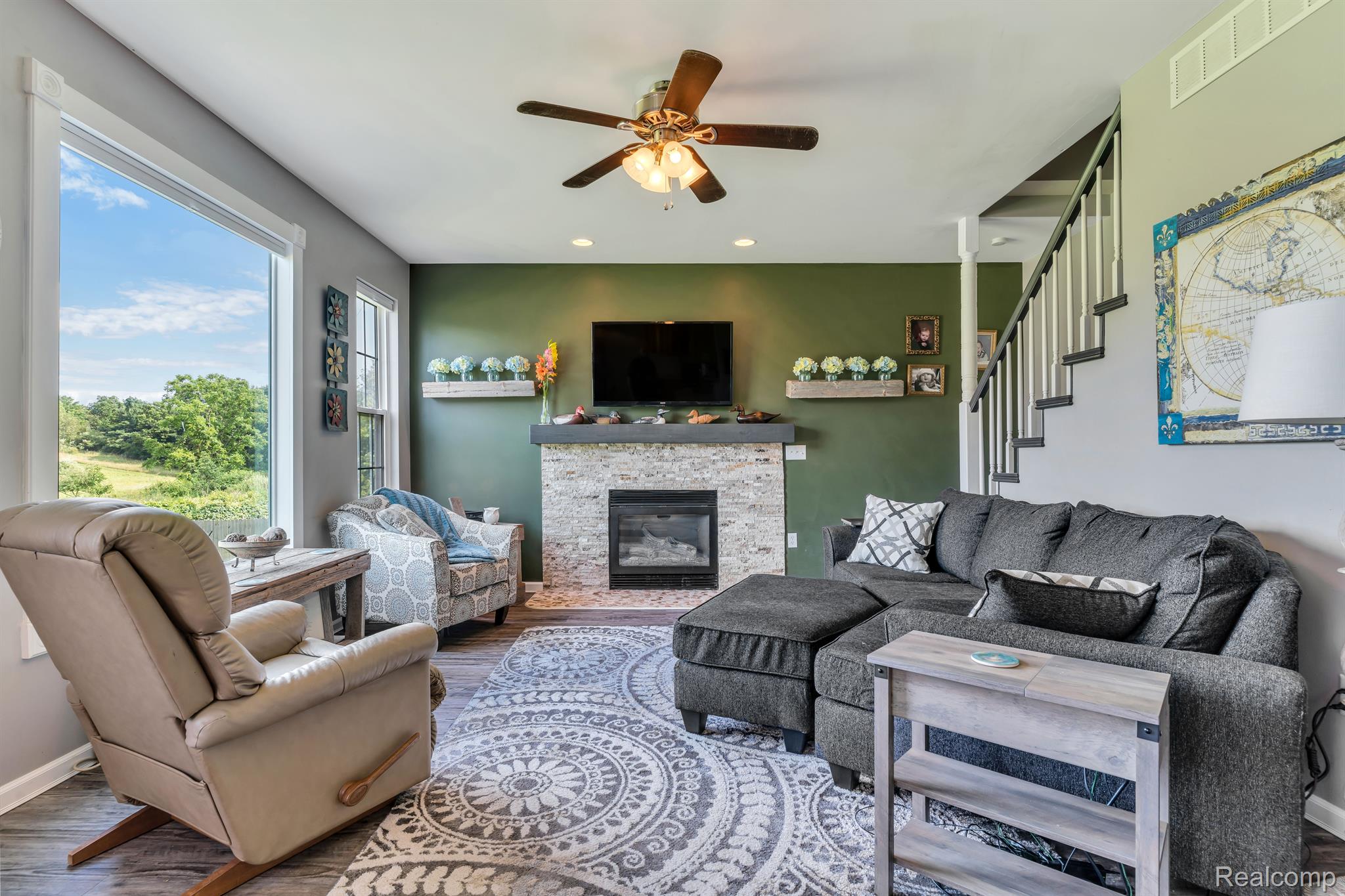 5389 Bentley Lake Road Howell, MI 48843 - Photo 12 of 48 This living room is so cozy! Gas lit fireplace