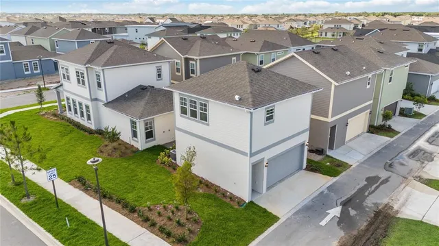 an aerial view of a house with a garden view