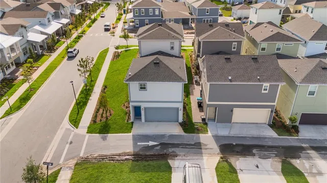 an aerial view of a house with swimming pool