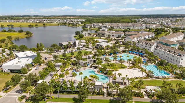 an aerial view of residential houses with outdoor space
