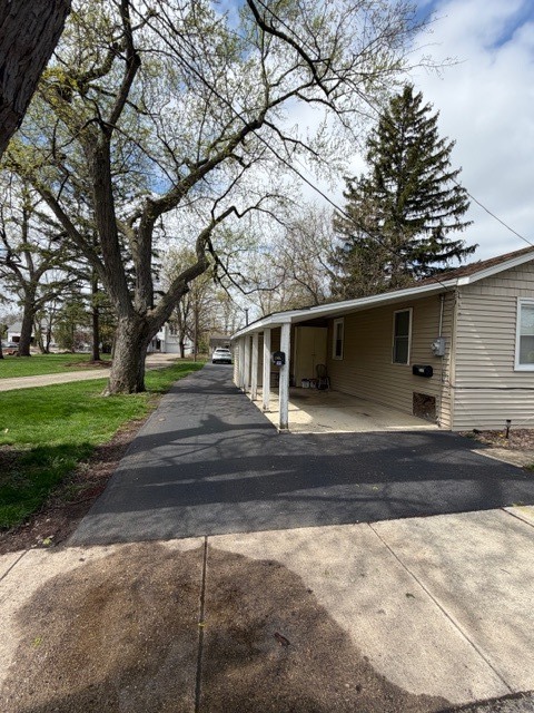 5938 Dunham Road Downers Grove, IL 60516 - Photo 14 of 15 a view of a house with a yard