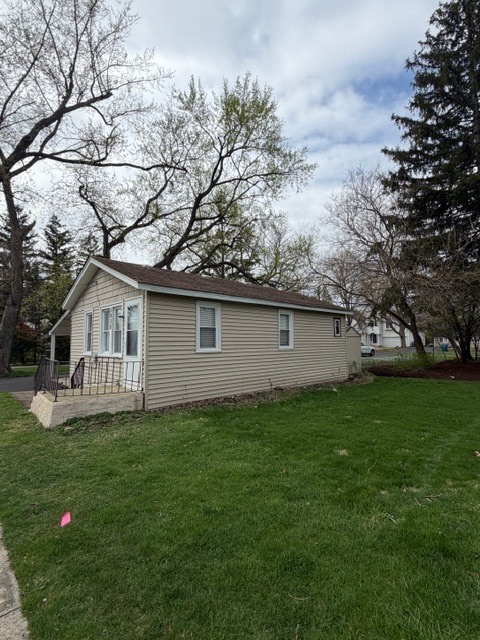5938 Dunham Road Downers Grove, IL 60516 - Photo 3 of 15 a house that has tree in front of it