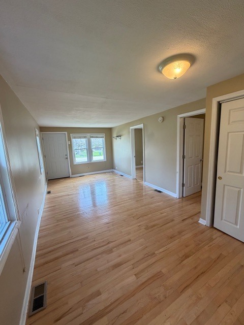 5938 Dunham Road Downers Grove, IL 60516 - Photo 4 of 15 a view of empty room with wooden floor