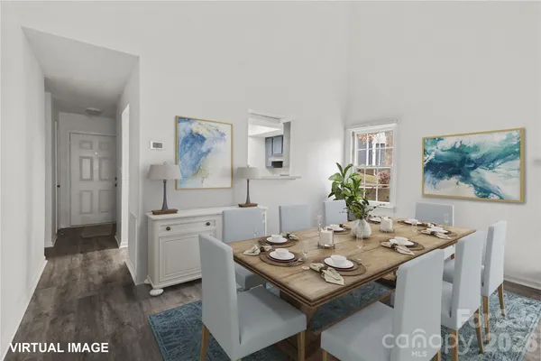 a view of a dining room with furniture and wooden floor