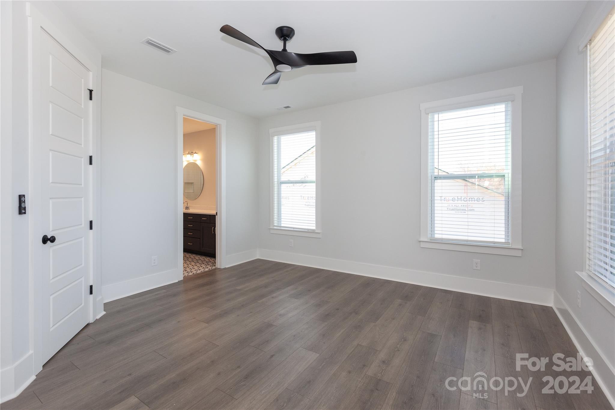 1405 Seigle Avenue Charlotte, NC 28205 - Photo 14 of 35 a view of empty room with wooden floor and fan