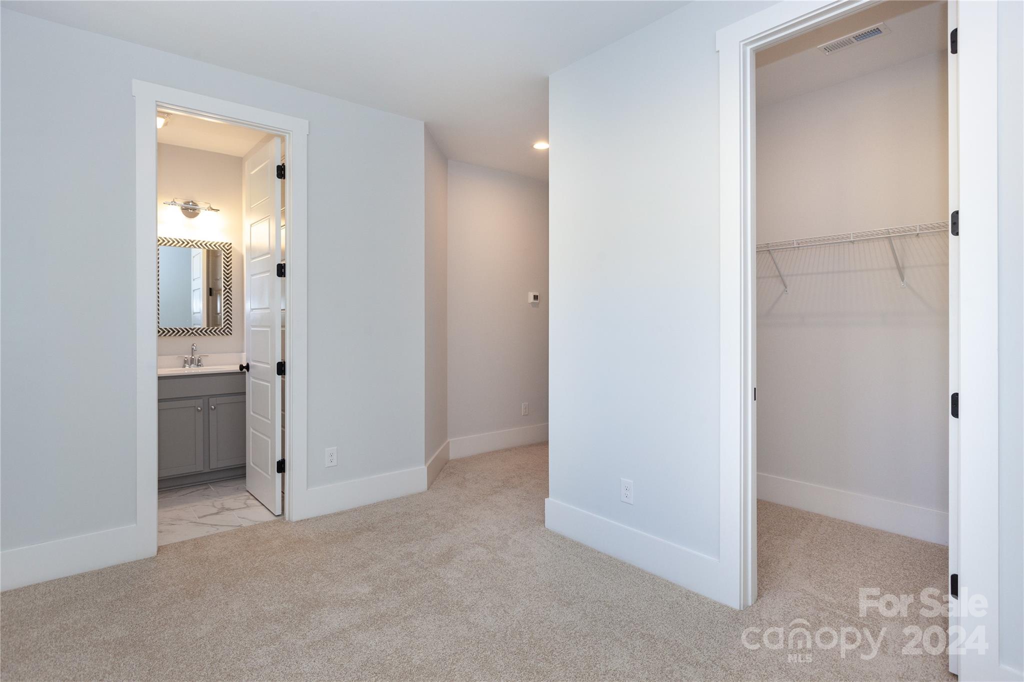 1405 Seigle Avenue Charlotte, NC 28205 - Photo 19 of 35 a view of a bathroom with a sink and mirror