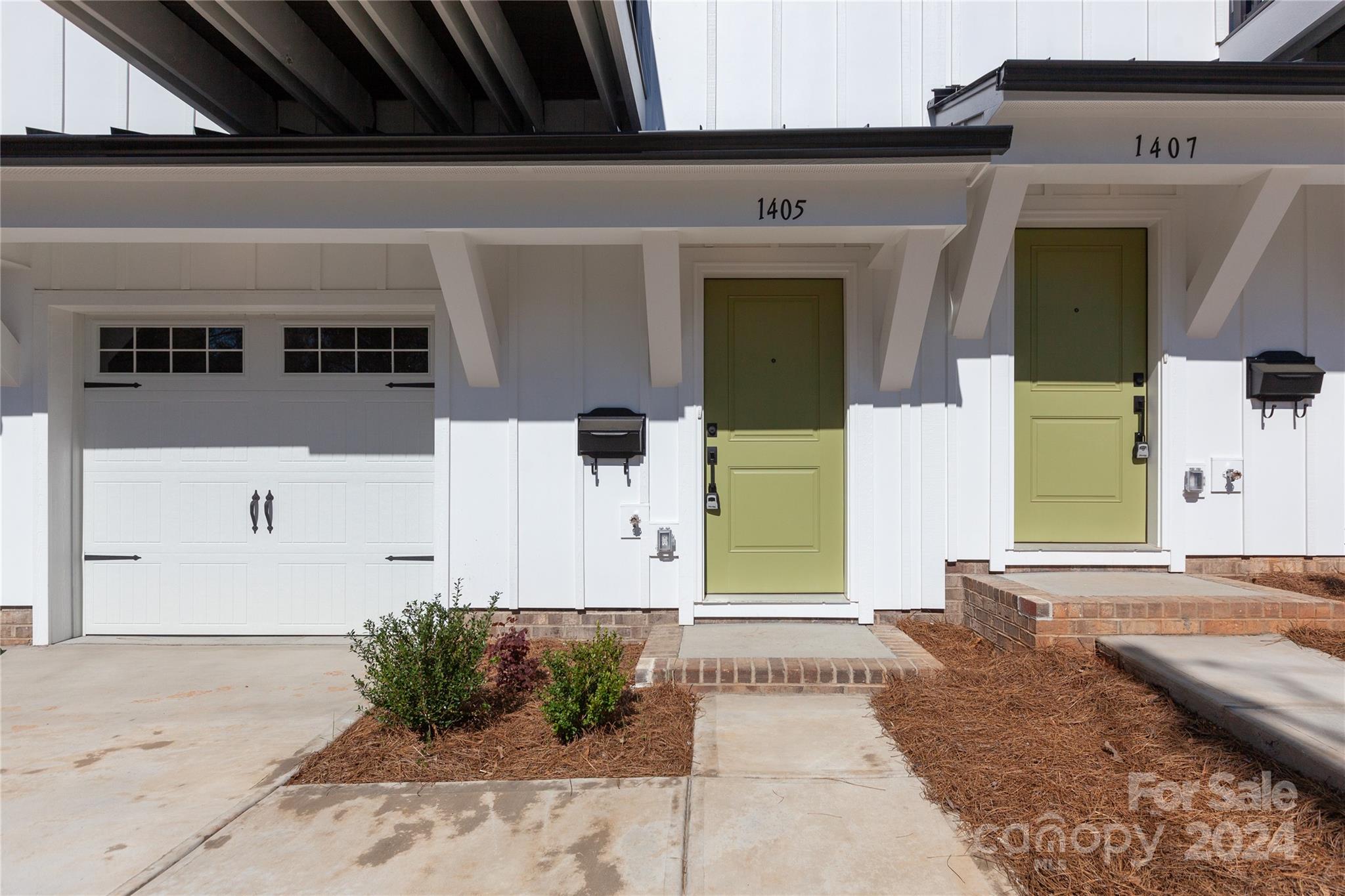 1405 Seigle Avenue Charlotte, NC 28205 - Photo 2 of 35 a view of a house with potted plants