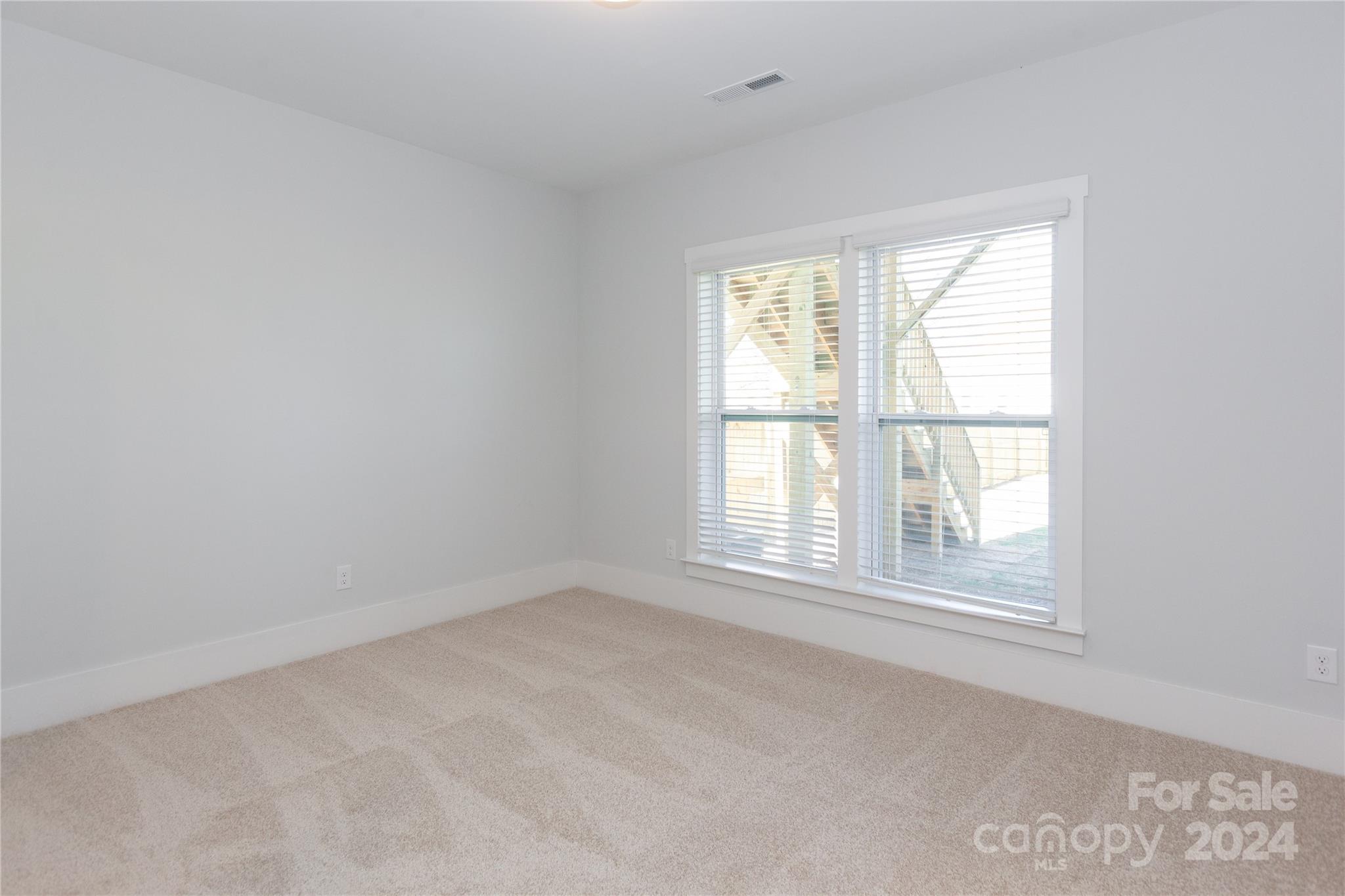 1405 Seigle Avenue Charlotte, NC 28205 - Photo 21 of 35 an empty room with a window