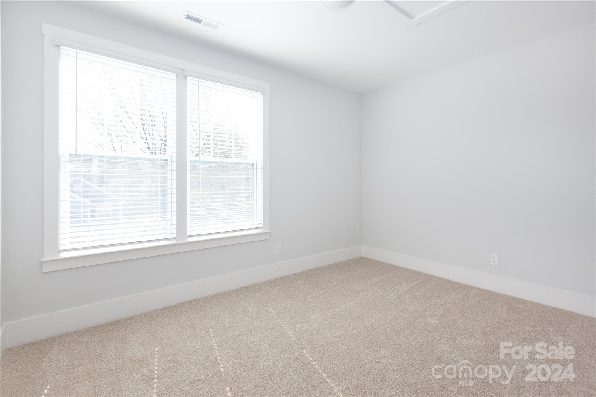 1405 Seigle Avenue Charlotte, NC 28205 - Photo 22 of 35 an empty room with a window