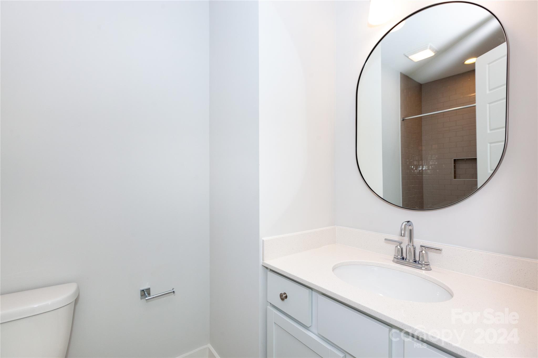 1405 Seigle Avenue Charlotte, NC 28205 - Photo 24 of 35 a bathroom with a sink and a mirror