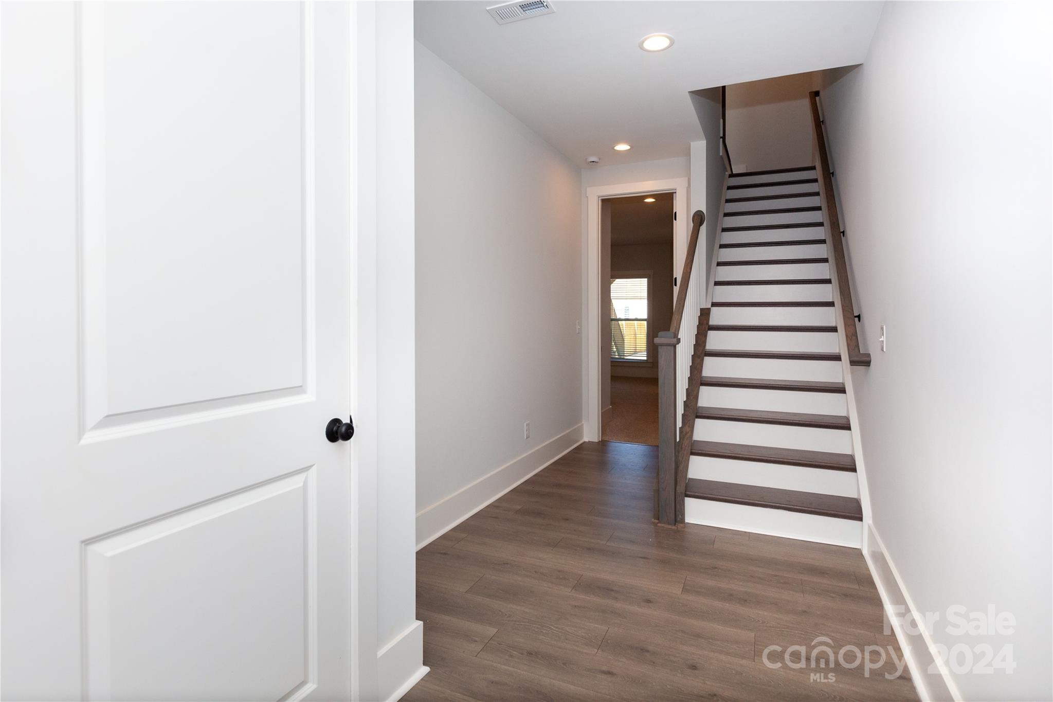 1405 Seigle Avenue Charlotte, NC 28205 - Photo 31 of 35 a view of a hallway with stairs and wooden floor