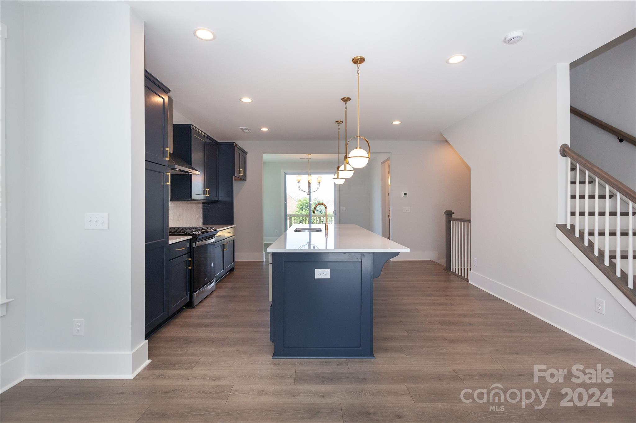 1405 Seigle Avenue Charlotte, NC 28205 - Photo 8 of 35 a view of kitchen and dining room with wooden floor