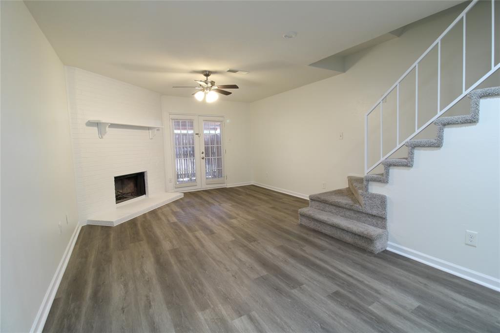 605 Carriagehouse Lane, Unit B2 Garland, TX 75040 - Photo 5 of 11 a view of empty room with wooden floor and fan