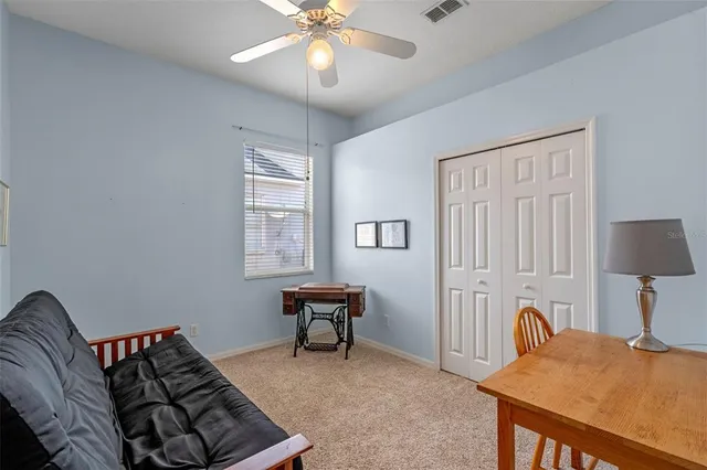 a bedroom with furniture and a window