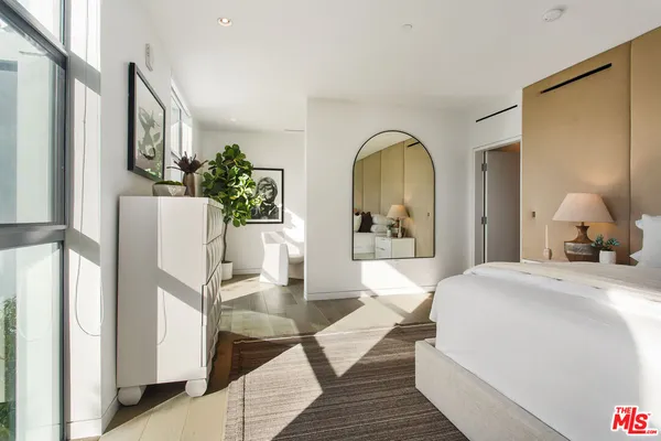 a bathroom with a granite countertop sink a mirror and a bathtub