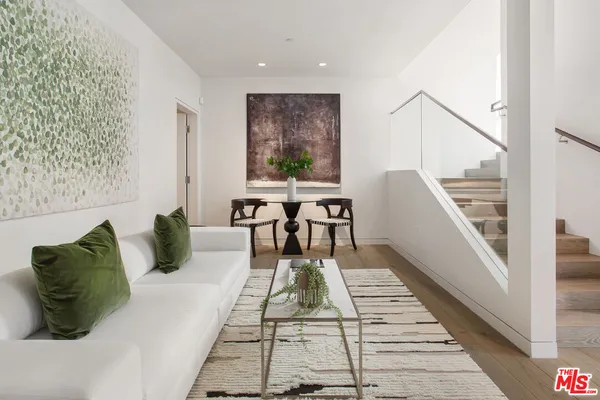 a view of a balcony with chairs