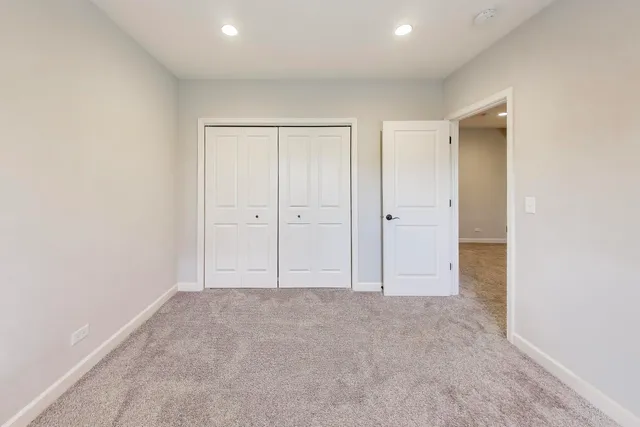 an empty room with closet area