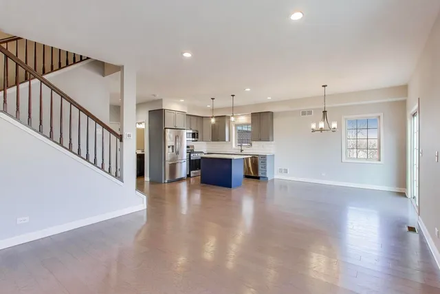 a view of a kitchen with a sink and a window