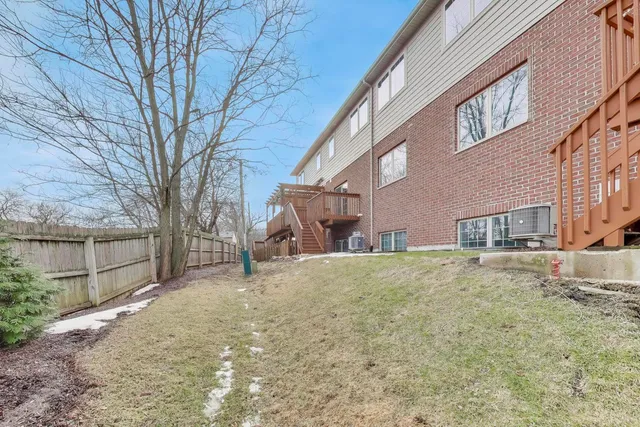 a view of a house with a snow in the yard