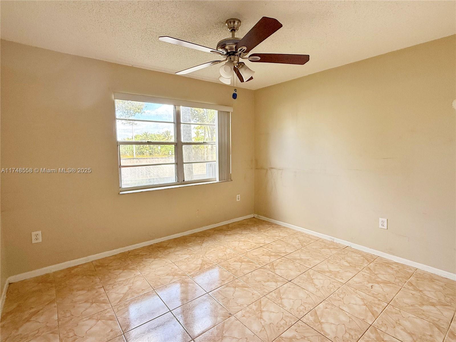 Tamiami Miami, FL 33184 - Photo 17 of 27 a view of an empty room with a window