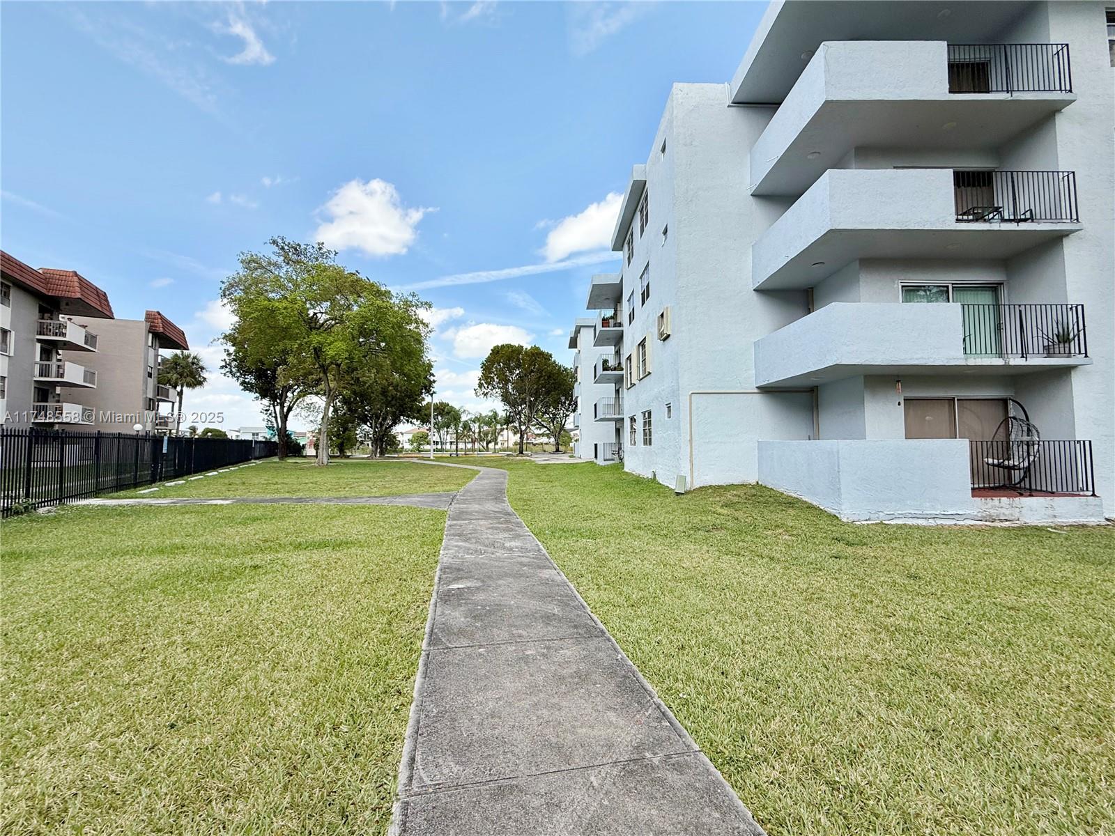 Tamiami Miami, FL 33184 - Photo 2 of 27 front view of a house with a yard