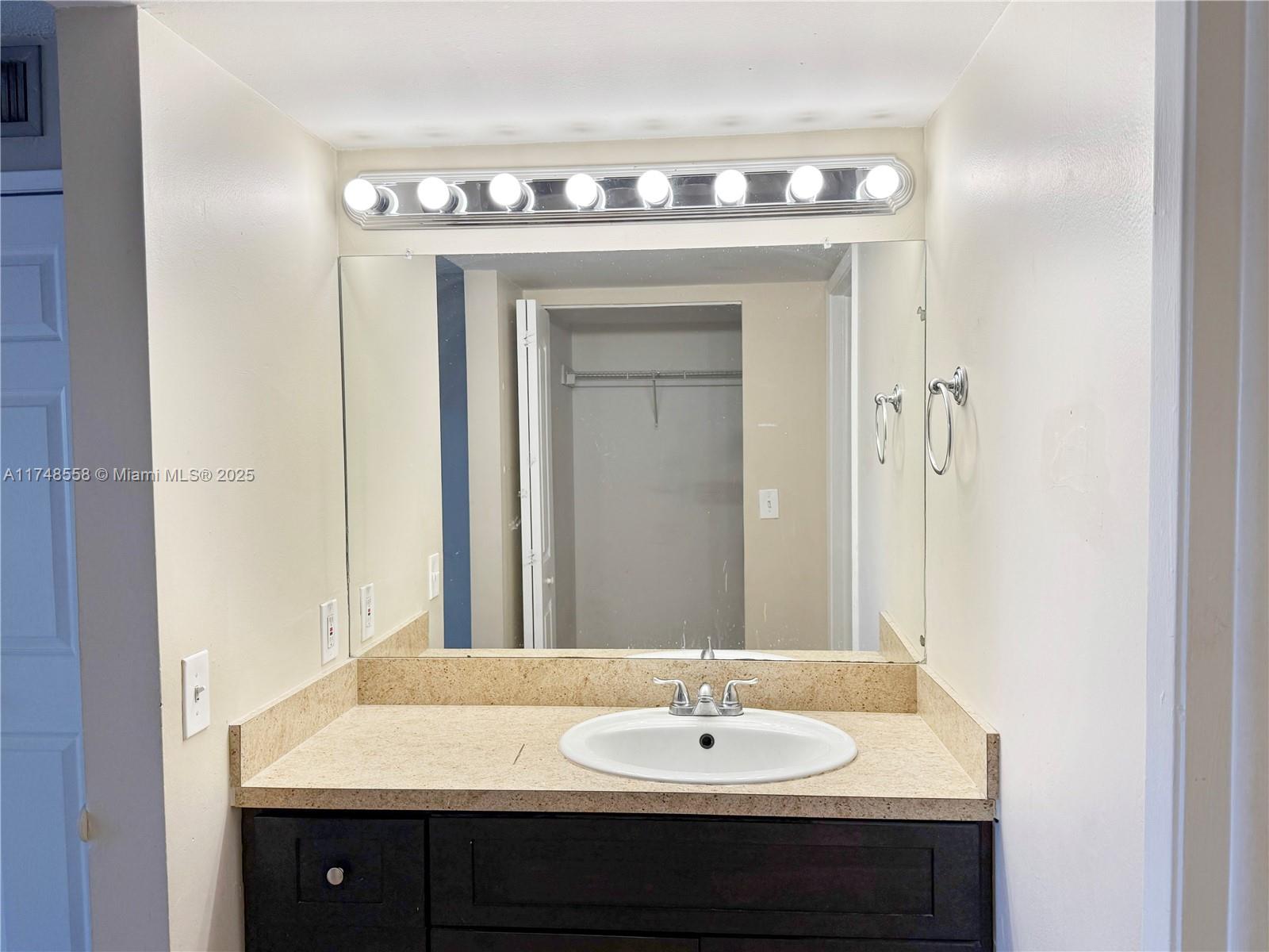 Tamiami Miami, FL 33184 - Photo 23 of 27 a bathroom with a sink and a mirror