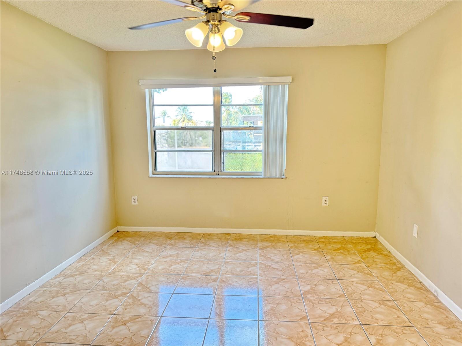 Tamiami Miami, FL 33184 - Photo 25 of 27 an empty room with a window