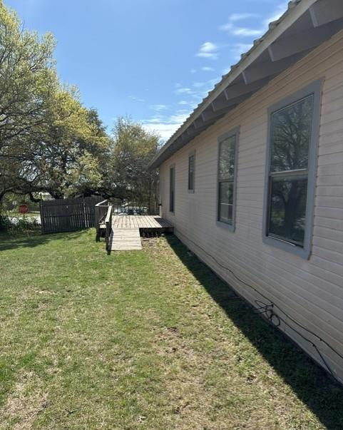 700 West 8th Street Cisco, TX 76437 - Photo 12 of 13 a front view of a house with a garden