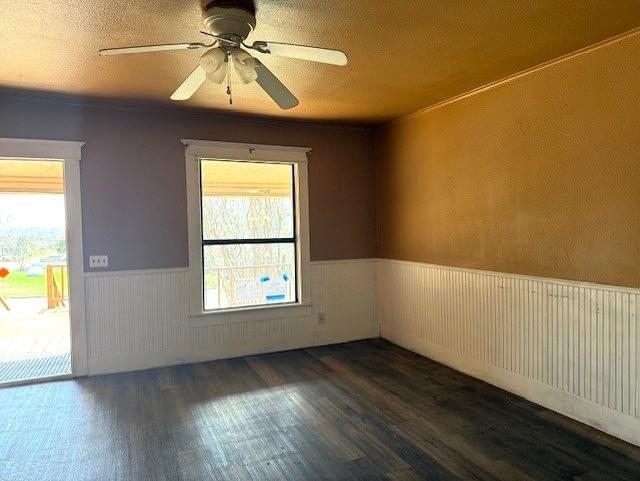 700 West 8th Street Cisco, TX 76437 - Photo 2 of 13 an empty room with a window and wooden floor