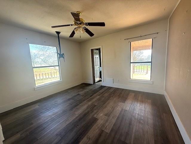 700 West 8th Street Cisco, TX 76437 - Photo 5 of 13 a view of an empty room with wooden floor and a window
