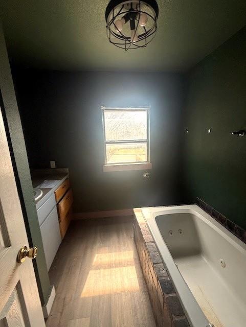 700 West 8th Street Cisco, TX 76437 - Photo 6 of 13 a bathroom with a tub sink and window