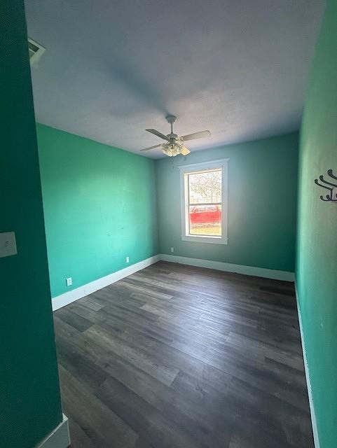 700 West 8th Street Cisco, TX 76437 - Photo 7 of 13 an empty room with wooden floor and windows
