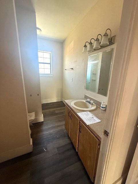 700 West 8th Street Cisco, TX 76437 - Photo 9 of 13 a bathroom with a sink a mirror and a toilet
