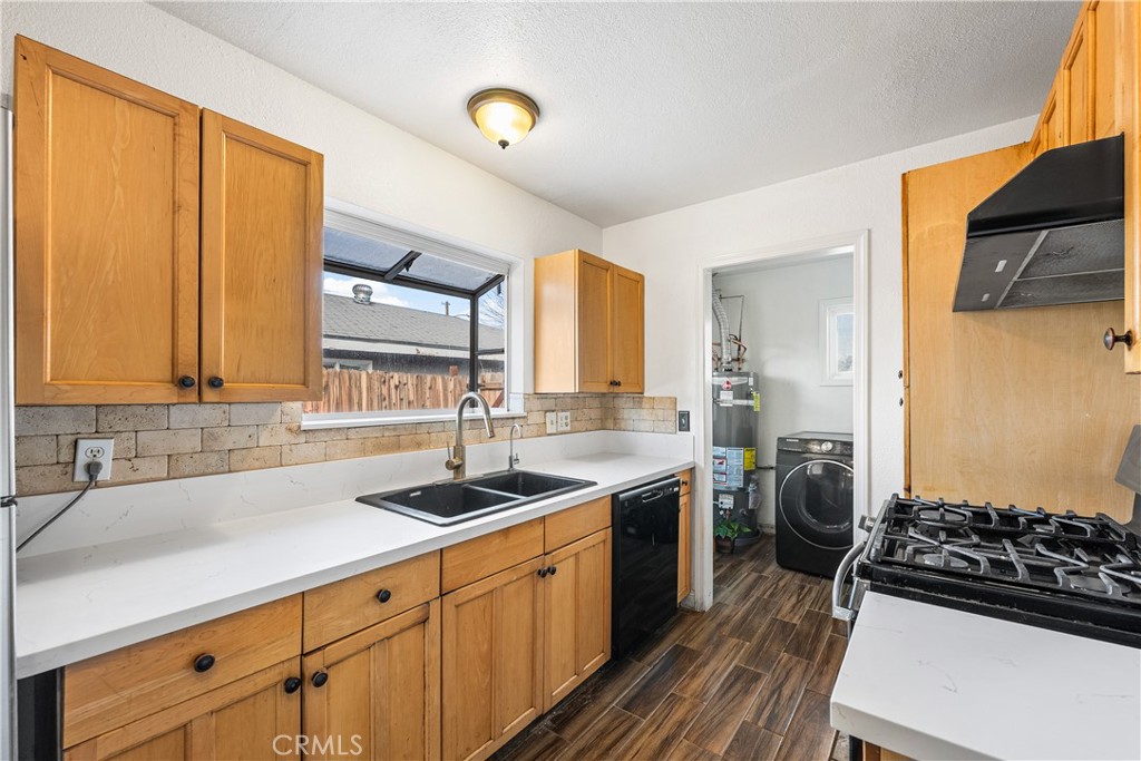 45323 Andale Avenue Lancaster, CA 93535 - Photo 1 of 29 a kitchen with a sink stove and cabinets
